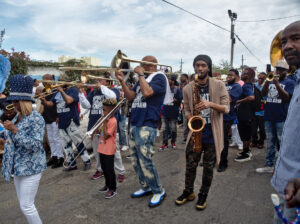 Photo of Black musicians performing in a parade.
