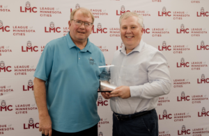 LMC President Ron Johnson and Austin City Administrator Craig Clark are picture at the May LMC Board of Directors meeting.