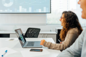 Smiling woman at business meeting