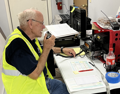 A man speaks over a radio system.