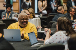 Two people chat and network at the 2024 Elected Leaders Institute.