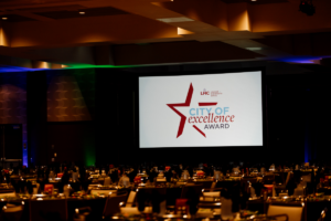 Ballroom with looping PowerPoint showing the City of Excellence Award slide.