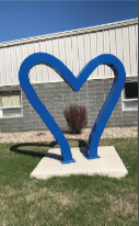 8-foot-tall by 10-foot-wide blue heart created by local artists