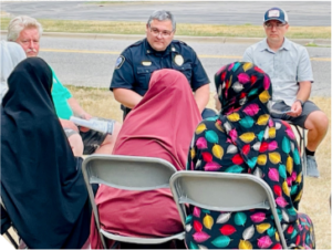 A small group of city staff and residents having a conversation.