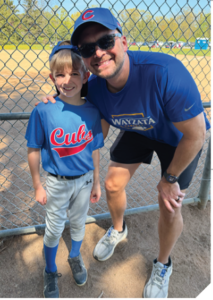 John and Luke Fischer at a baseball game.