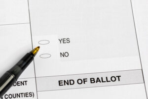 Ballot that shows a pen hovering over "yes" or "no" bubble responses. Text that reads "end of ballot" below