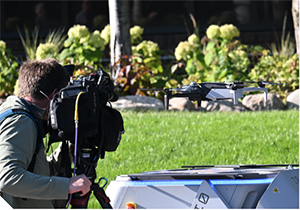 Person filming a drone.