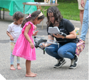 Drone representative talking to a young person.
